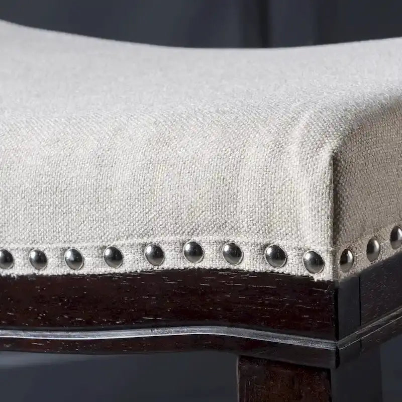 Tabouret de bar contemporain rembourré en forme de selle avec garniture cloutée, pieds marron foncé