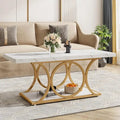 Table basse rectangulaire avec plateau effet marbre et piètement géométrique en métal doré